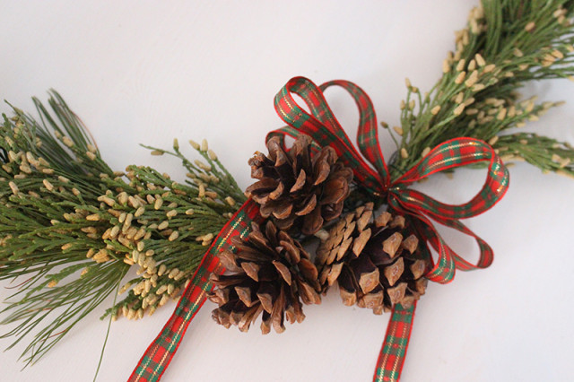 brass-ring-christmas-wreath-pinecones-ribbon