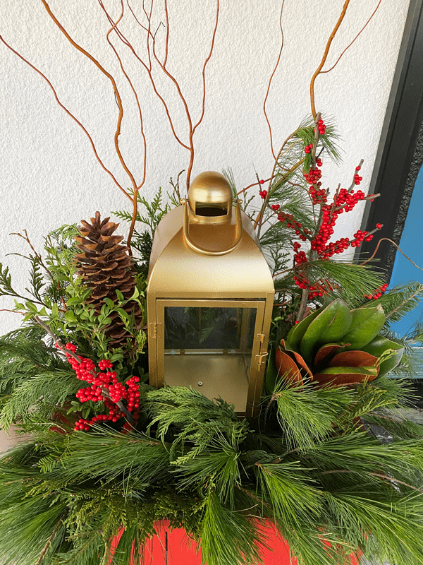 White Floral and Mixed Pine Christmas Centerpiece With Lantern